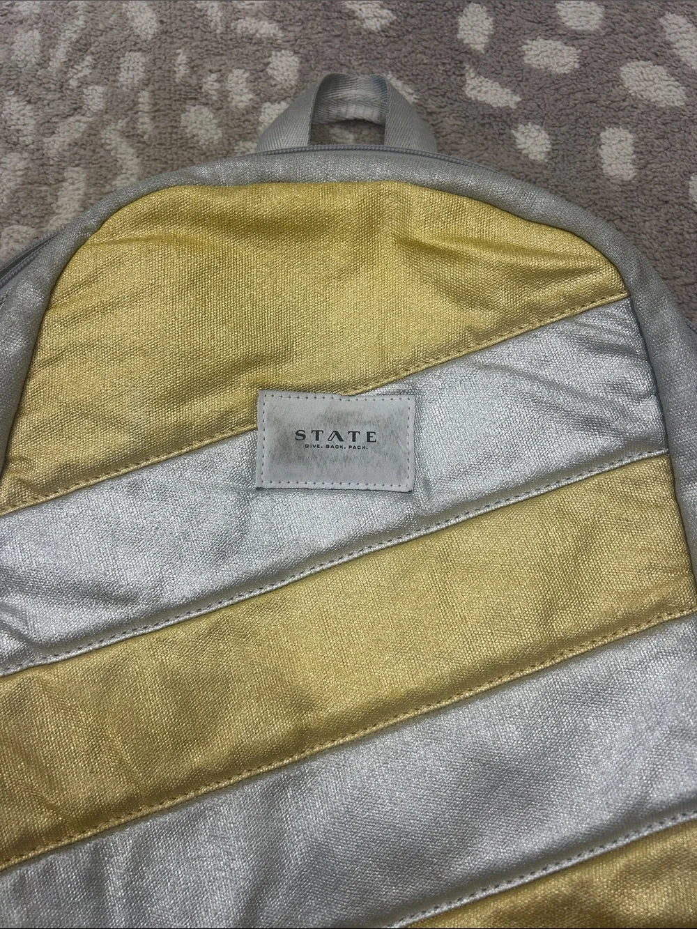 STATE Silver and Gold Diagonal Stripe Backpack